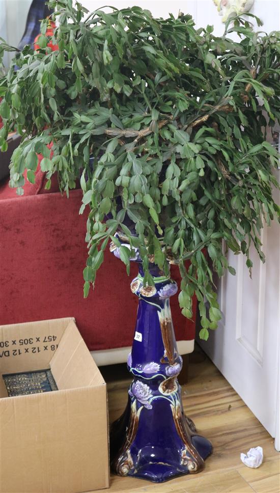 A jardiniere with pedestal and Christmas cactus